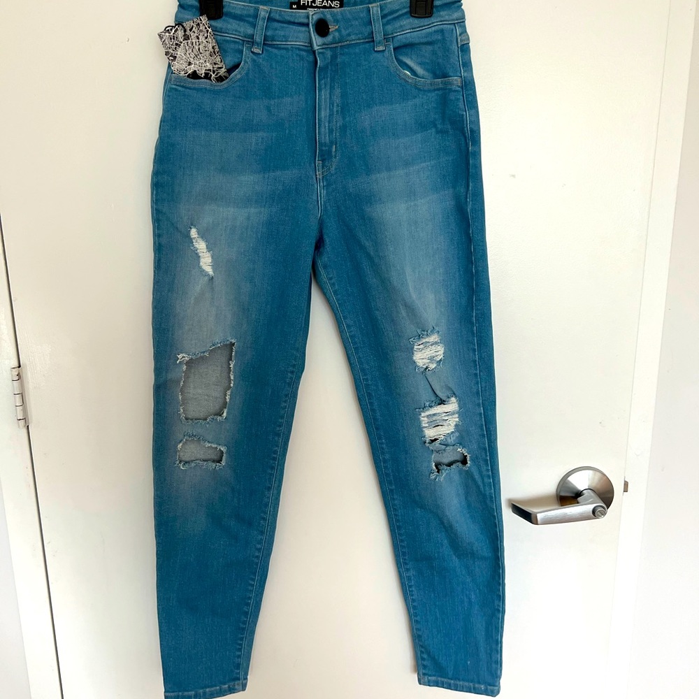 Never worn- tags on. Super ripped high waisted fitjeans. mom jeans fit